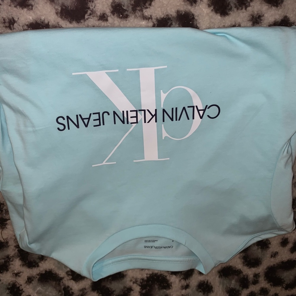 Calvin Klein jeans tee shirt, teal blue, medium, and never been worn